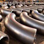 Long radius pipe bends with extended straight tangent ends