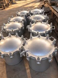 Round tank manways showing domed covers and perimeter closure hardware